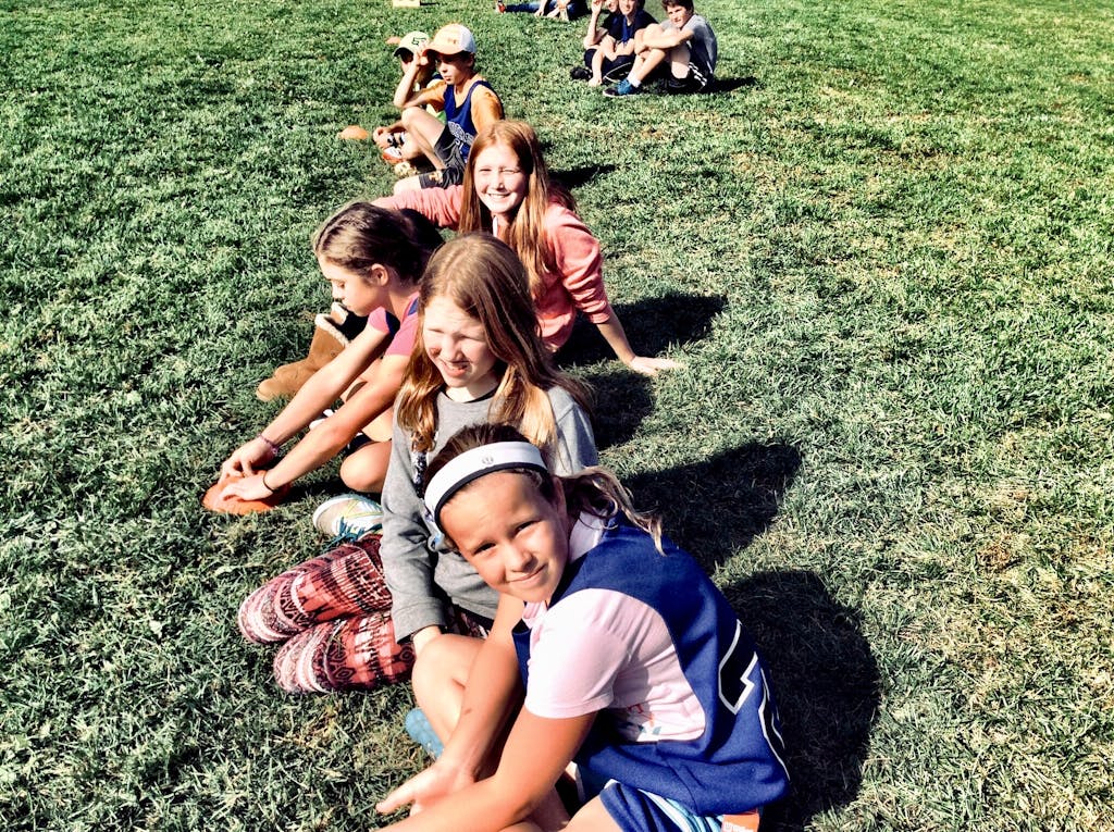 Photography of People On Grass Field